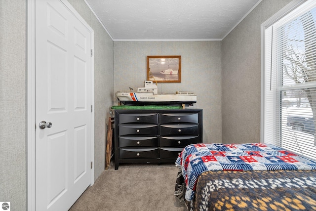 bedroom featuring ornamental molding and carpet