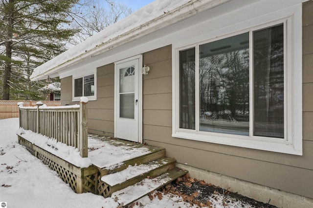 view of snow covered property entrance