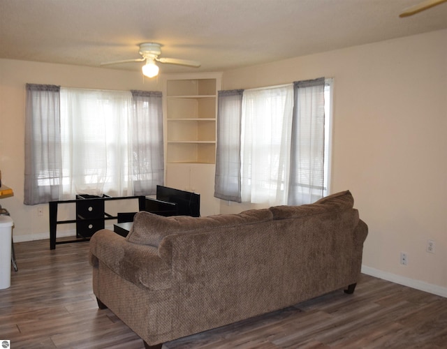 living room with ceiling fan, a healthy amount of sunlight, and hardwood / wood-style floors