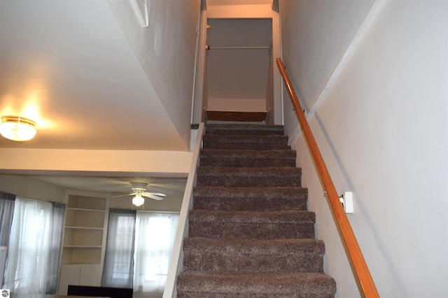 stairs with ceiling fan