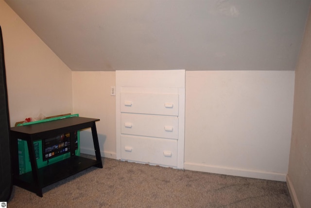 playroom featuring lofted ceiling and carpet flooring