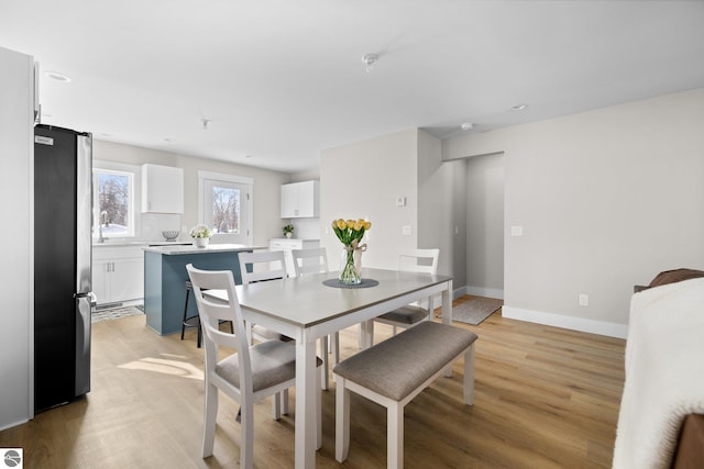 dining room with light wood-type flooring