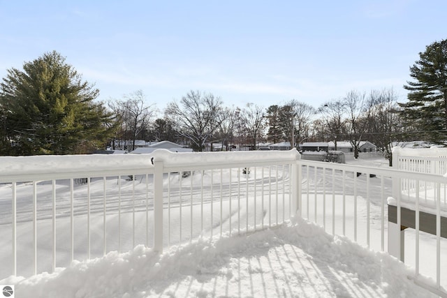 view of snow covered deck