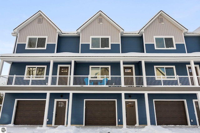 townhome / multi-family property featuring a garage