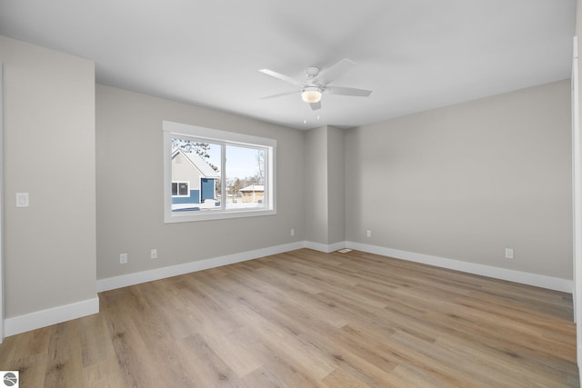 unfurnished room with light hardwood / wood-style floors and ceiling fan