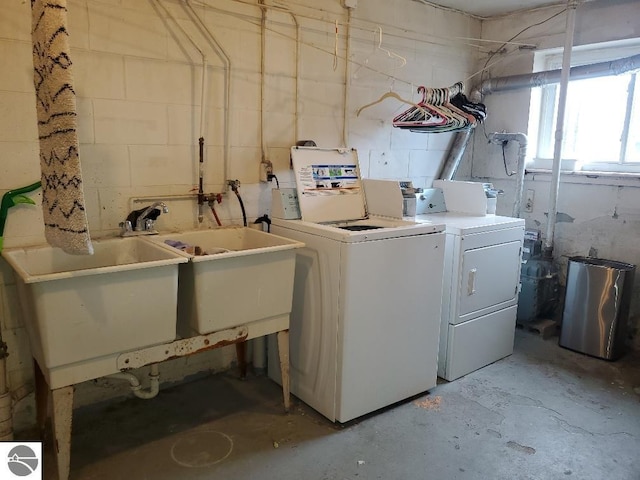 clothes washing area featuring washer and dryer