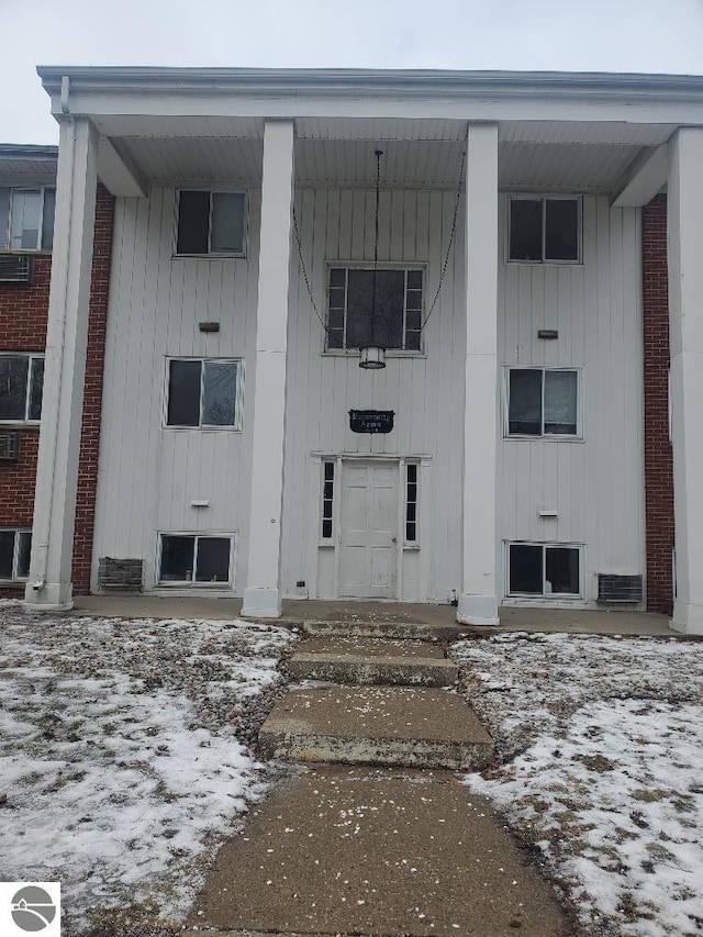 view of snow covered property