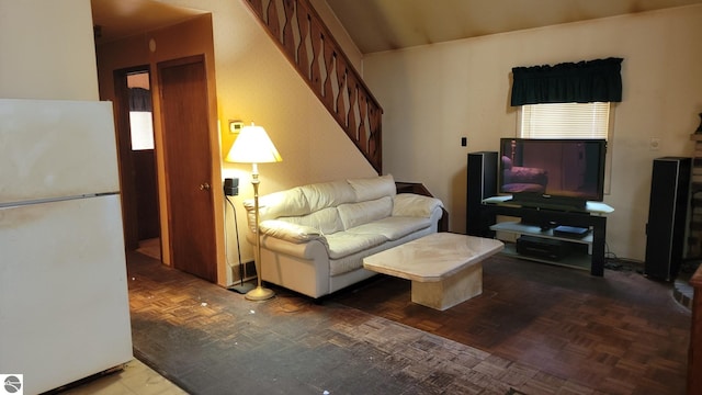 living room featuring dark parquet flooring