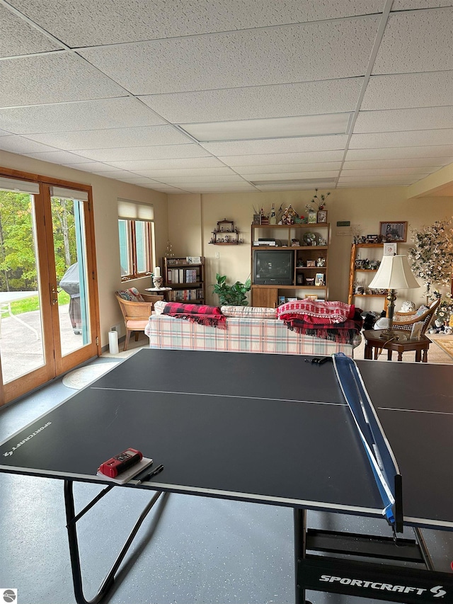 recreation room featuring a paneled ceiling