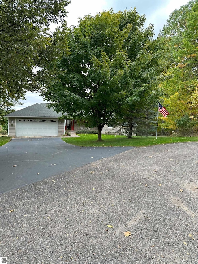 obstructed view of property featuring a garage