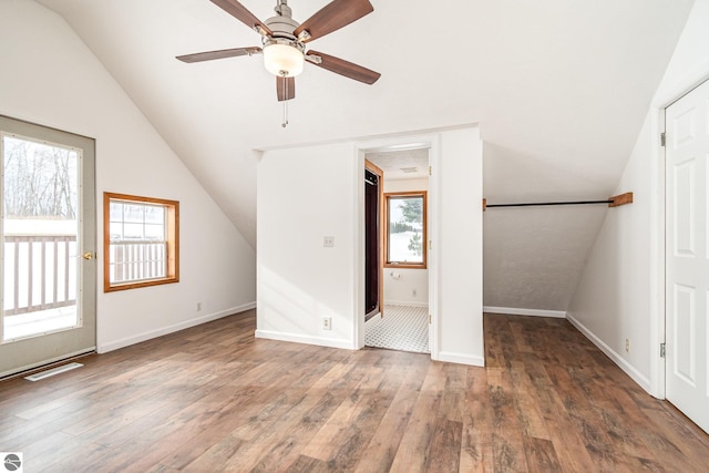 bonus room featuring lofted ceiling, dark wood-type flooring, and ceiling fan