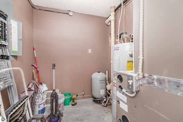 utility room featuring water heater