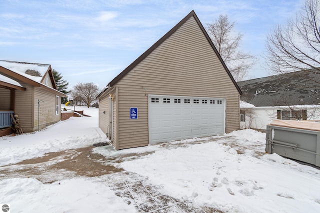 view of snow covered garage