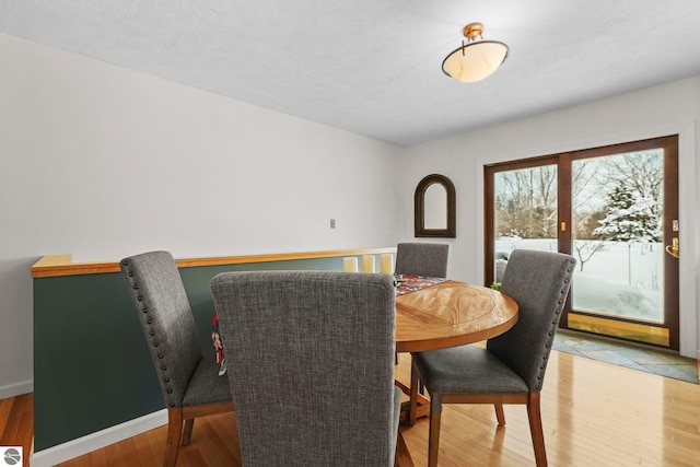 dining room with light wood-type flooring