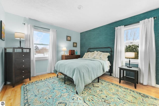 bedroom with light hardwood / wood-style flooring