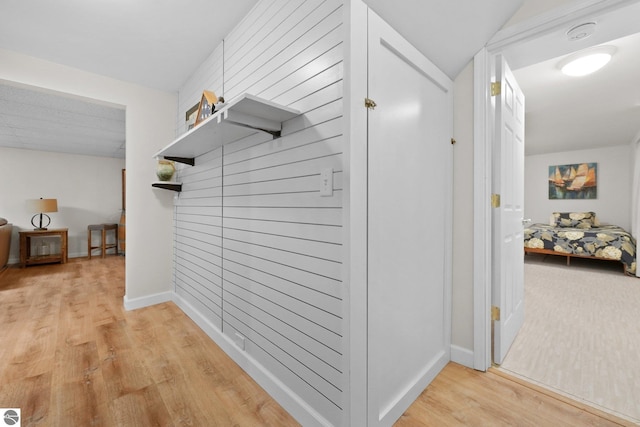 corridor featuring light hardwood / wood-style floors