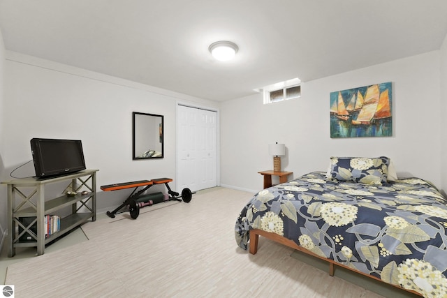 bedroom with hardwood / wood-style flooring and a closet