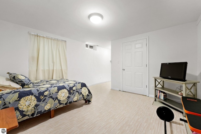 bedroom featuring hardwood / wood-style flooring