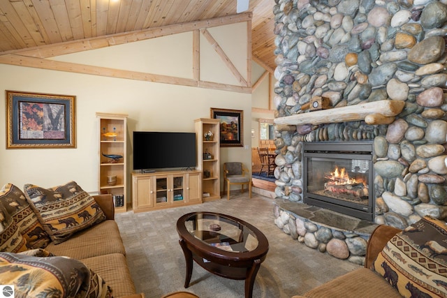 carpeted living room featuring beamed ceiling, high vaulted ceiling, wooden ceiling, and a fireplace