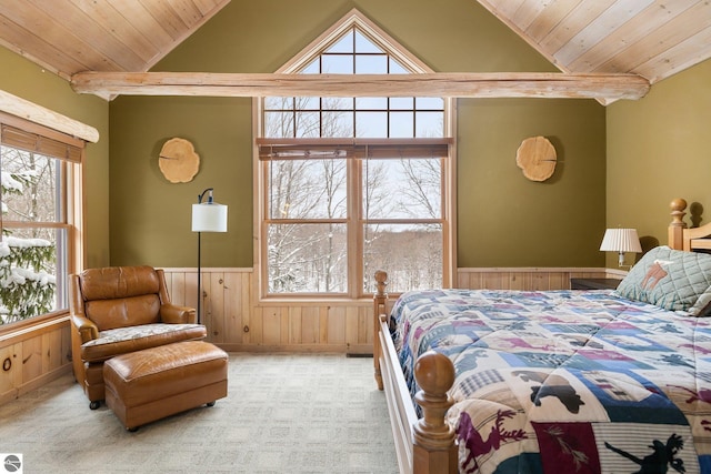 bedroom featuring multiple windows, light colored carpet, and wooden ceiling