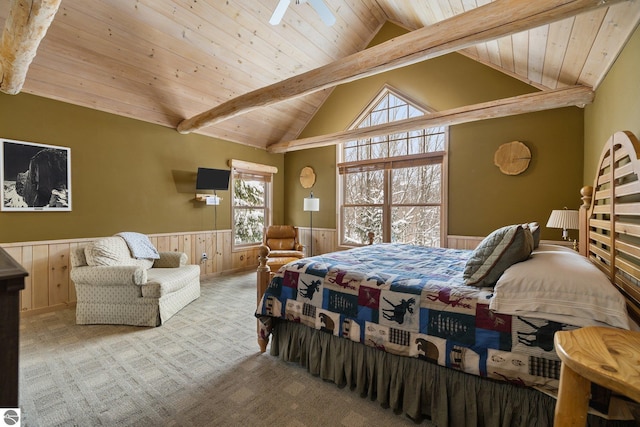 carpeted bedroom with vaulted ceiling with beams and wooden ceiling