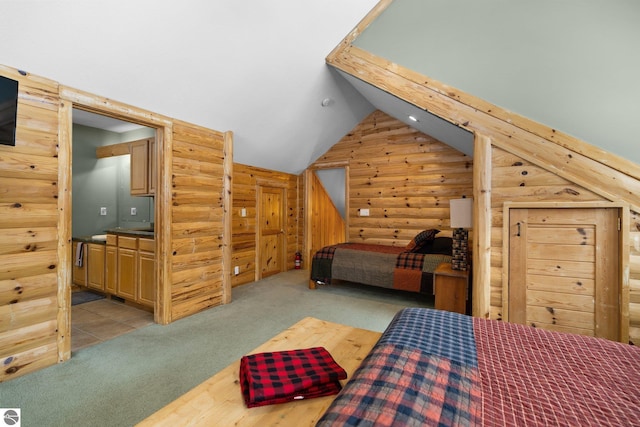 carpeted bedroom with rustic walls and vaulted ceiling