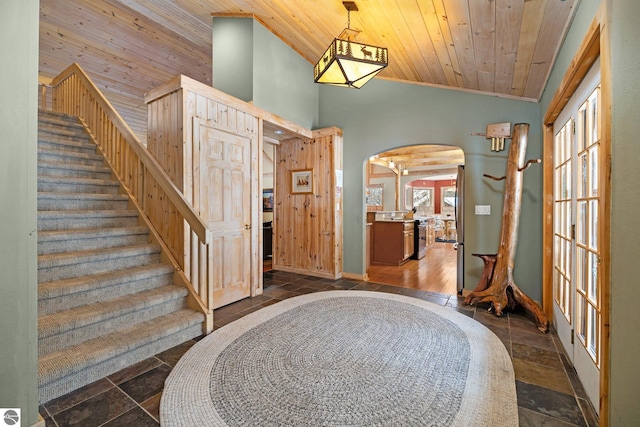 entrance foyer featuring lofted ceiling and wooden ceiling