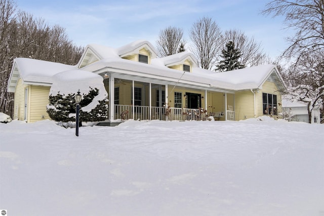 new england style home with covered porch