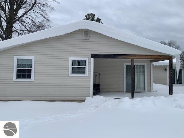 view of snow covered house