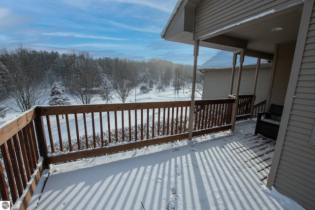 view of snow covered deck