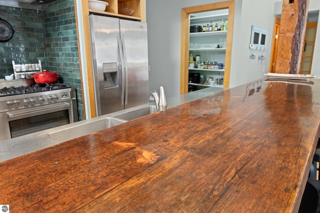 kitchen featuring tasteful backsplash and stainless steel appliances