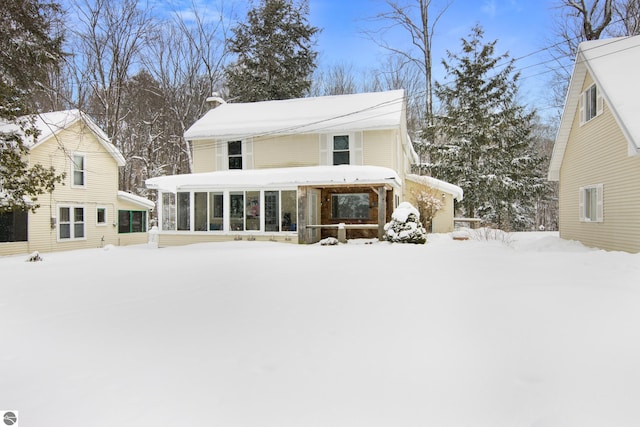 view of front of property featuring a sunroom