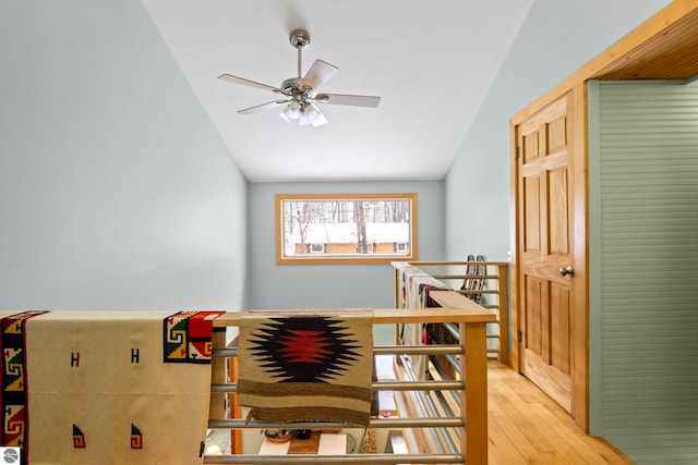 interior space with wood-type flooring and vaulted ceiling