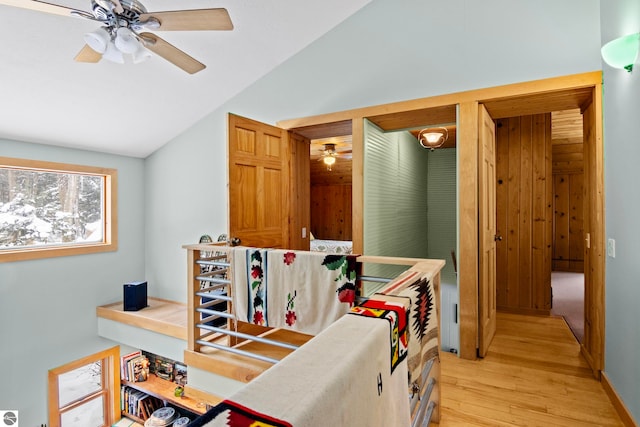 interior space featuring lofted ceiling and light hardwood / wood-style floors