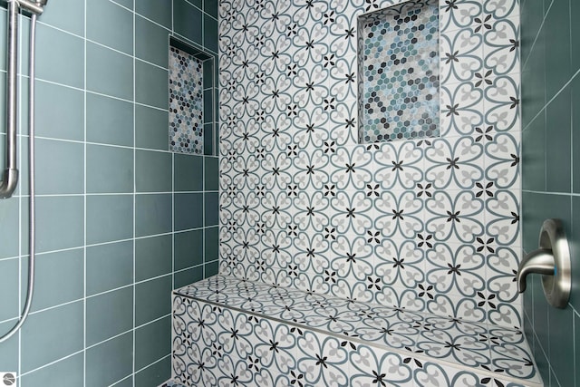 bathroom with tiled shower