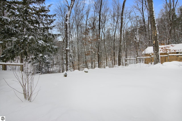 view of yard layered in snow