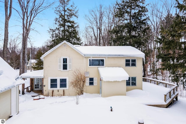 view of snow covered house