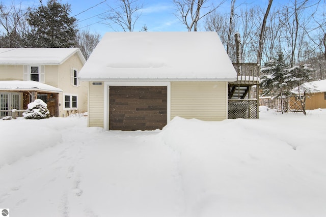 view of snow covered garage