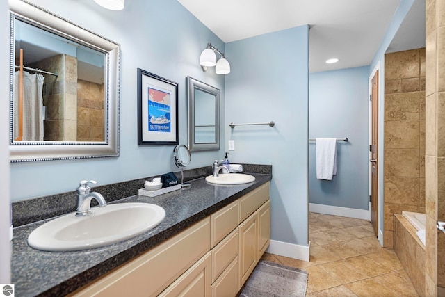 bathroom featuring vanity, tile patterned floors, and shower with separate bathtub