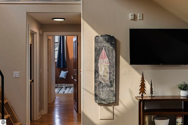 hallway with dark hardwood / wood-style floors