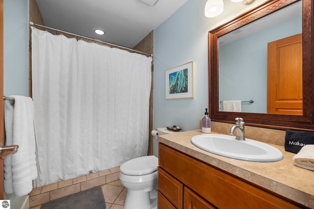 bathroom with tile patterned floors, toilet, and vanity