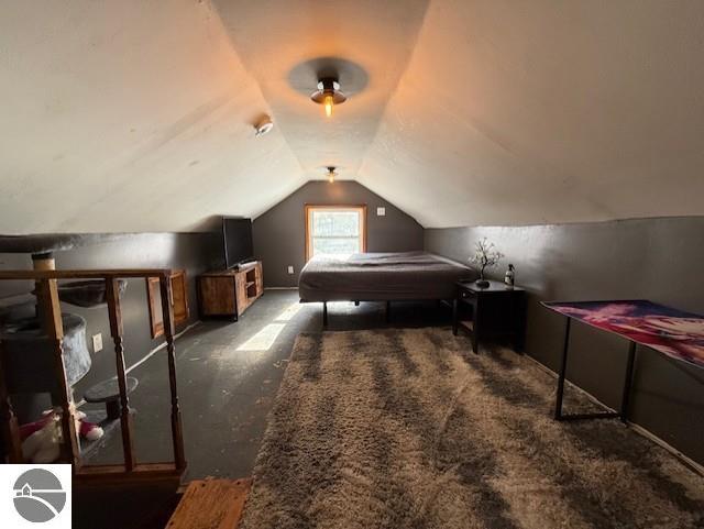 bedroom featuring lofted ceiling