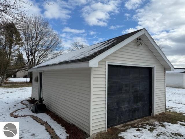 view of snow covered garage