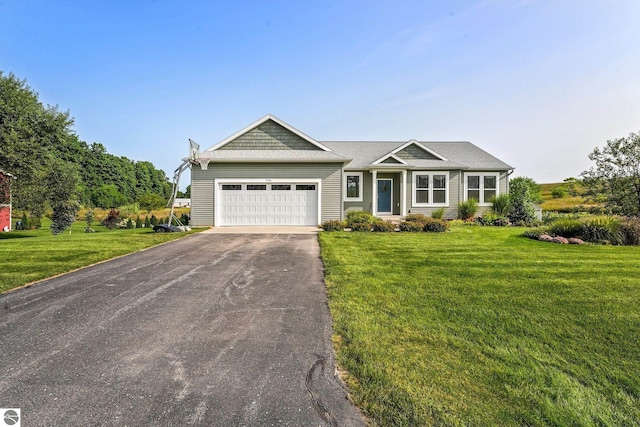 view of front facade featuring a garage and a front yard