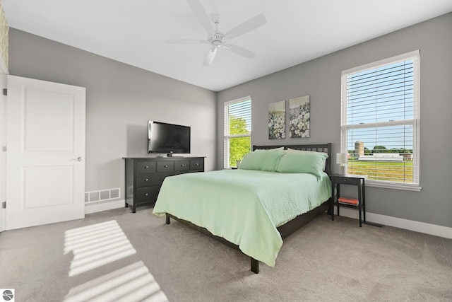 bedroom with ceiling fan and light colored carpet