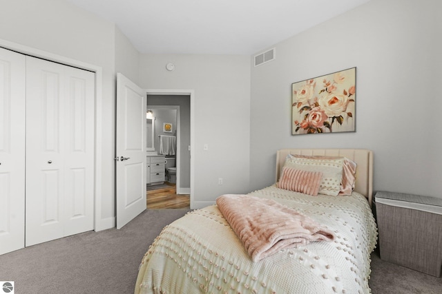 bedroom featuring dark carpet and a closet