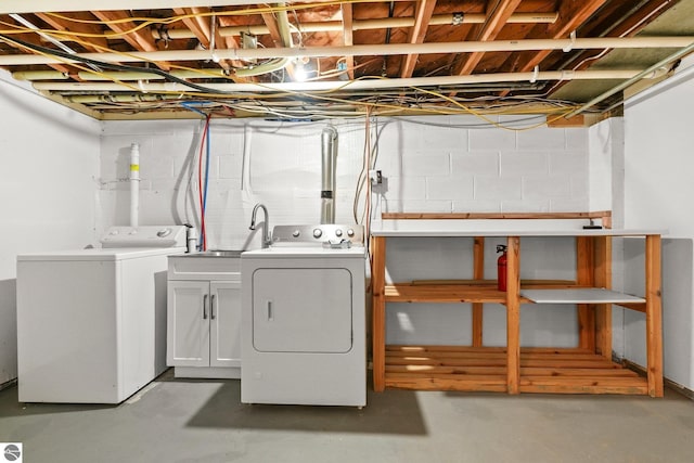 laundry area featuring separate washer and dryer and sink