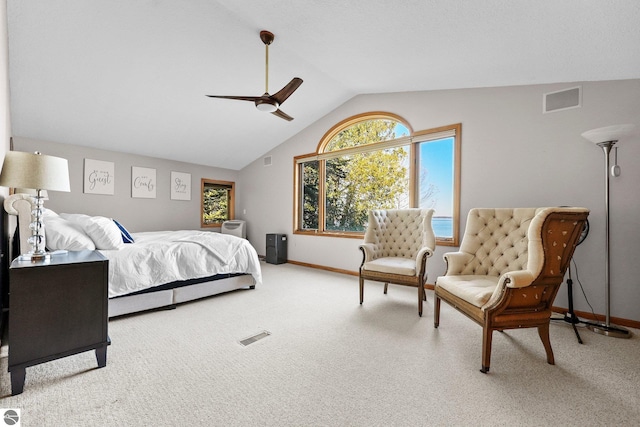 carpeted bedroom featuring vaulted ceiling and ceiling fan