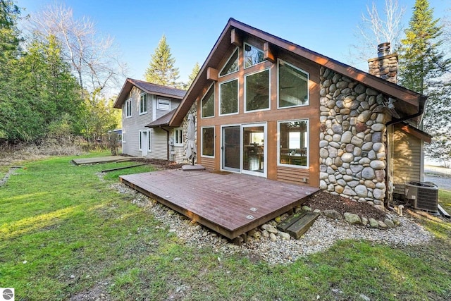 back of house featuring central AC, a yard, and a wooden deck