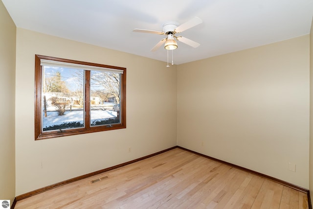 spare room with ceiling fan and light hardwood / wood-style floors